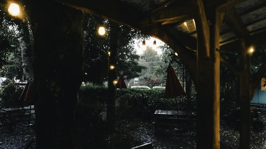 Person carefully walking on wet outdoor patio surface near entrance during rain