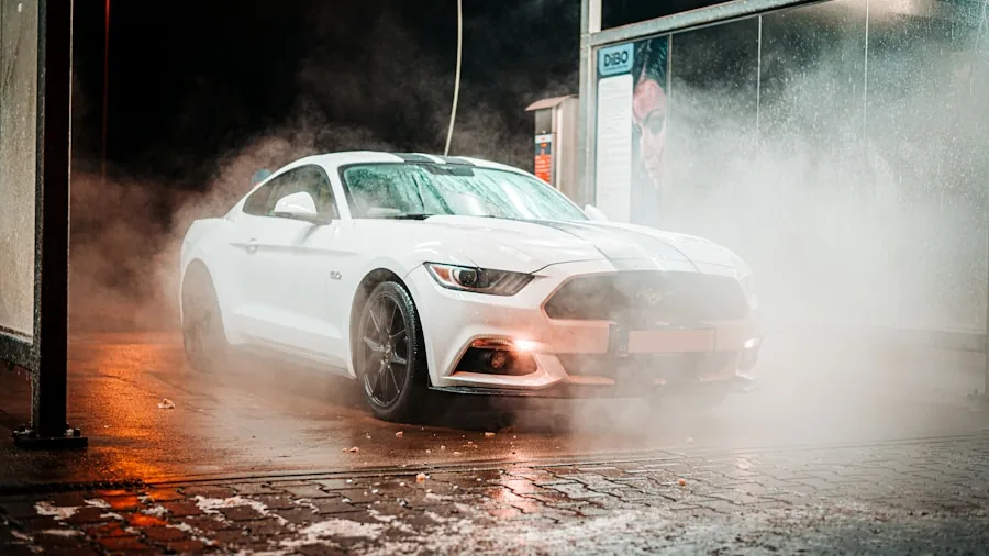 Person carefully washing a car with soapy water to maintain ceramic coating protection