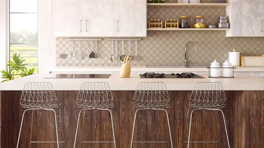 Person charging wireless kitchen lighting device under cabinet in modern home