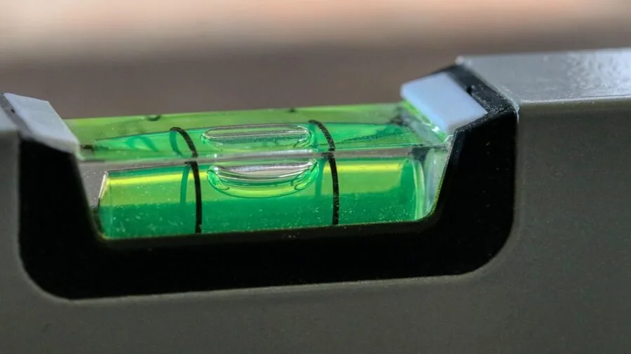 Person checking battery percentage on portable device screen during daily use