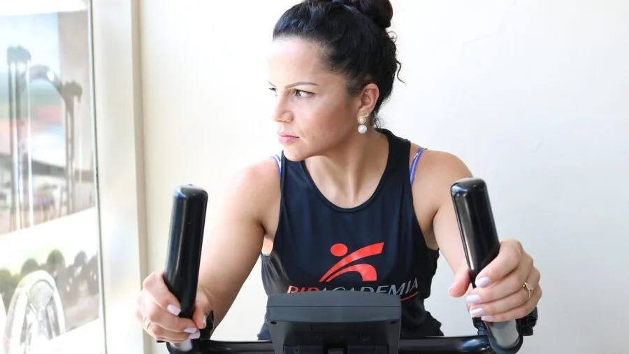 Person checking proper fit of athletic knee protection during outdoor activity