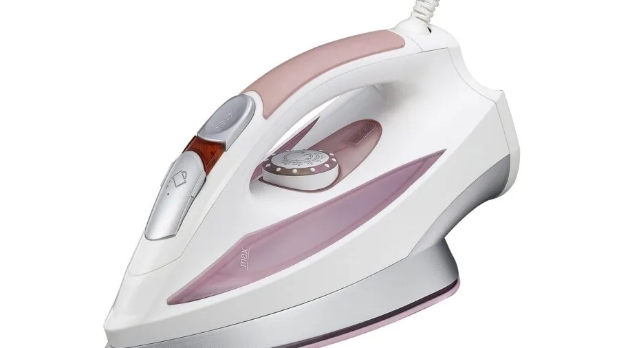 Person cleaning and maintaining home appliance equipment in bright kitchen