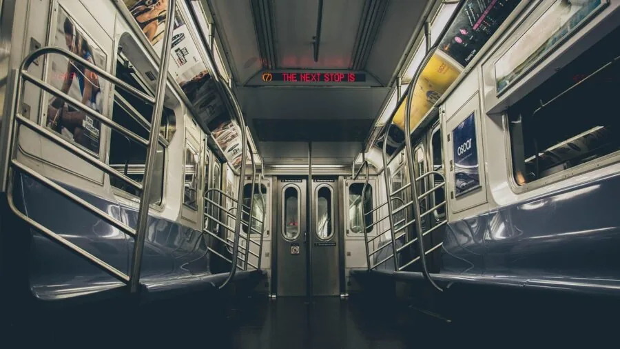Person cleaning out car interior trash and waste during daily commute routine