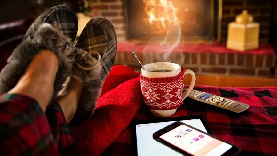 Person comfortably reading on tablet device in relaxed lifestyle setting