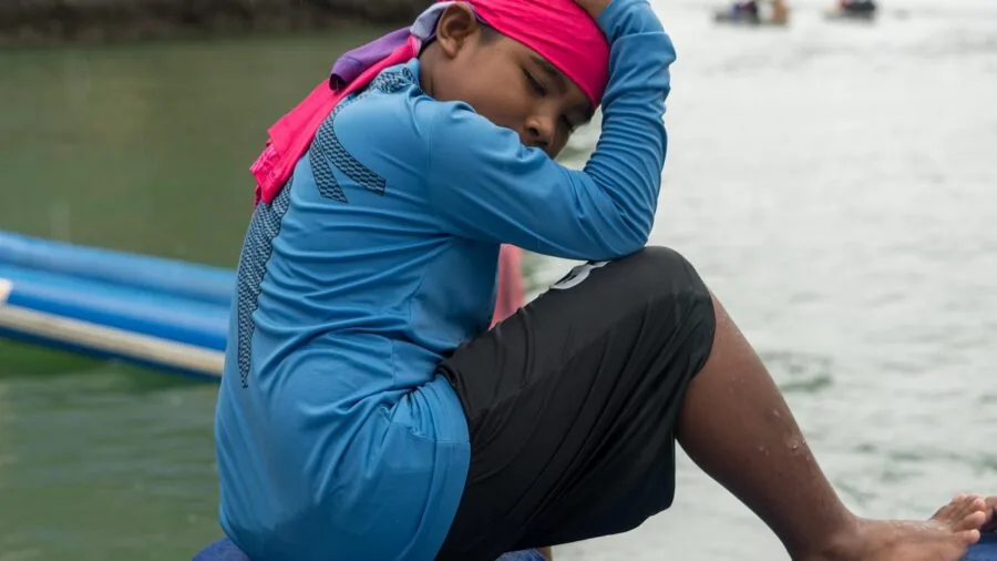 Person comfortably wearing a cotton bandana while enjoying outdoor activities in natural daylight