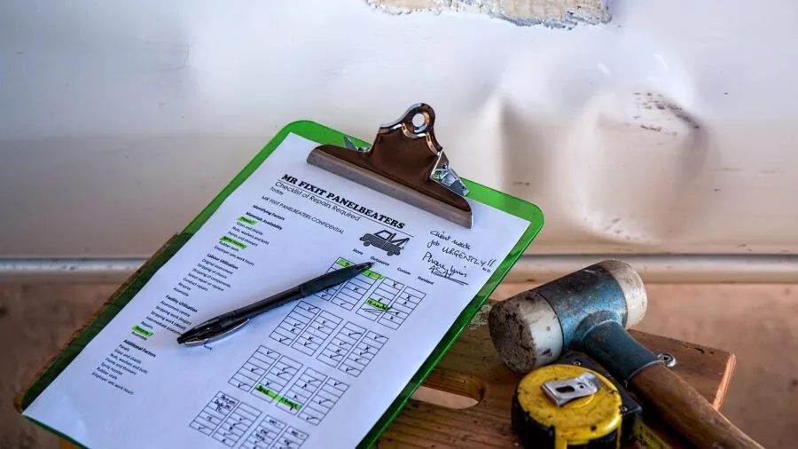 Person comparing different product packages and prices while planning a home repair project