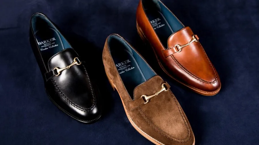 Person comparing different shoe options while shopping, evaluating value and price choices