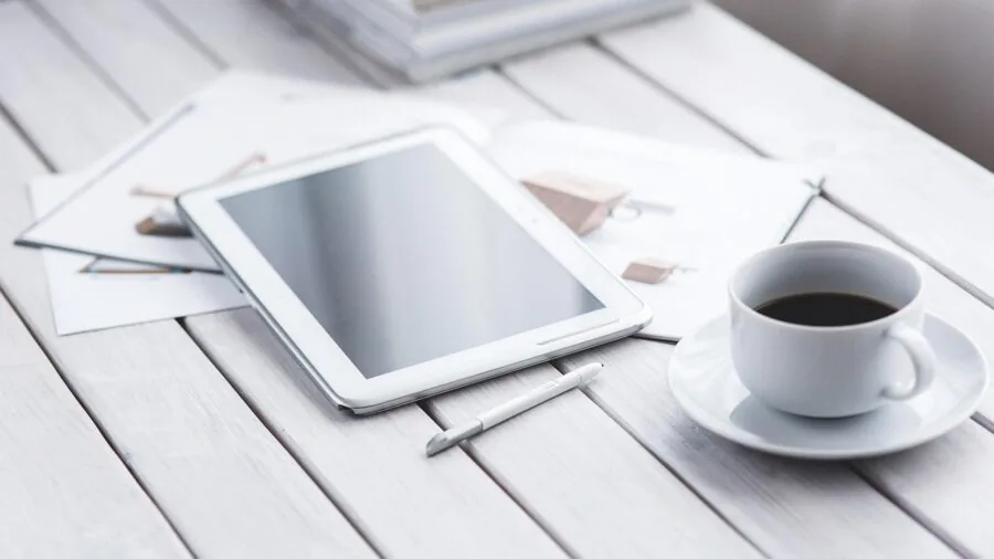 Person comparing tablet size with keyboard case to ensure proper fit and compatibility
