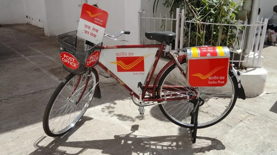 Person cycling on electric bike through natural outdoor setting with pedal assistance