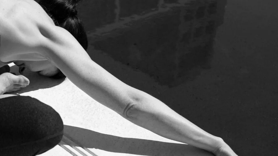 Person demonstrating back reach and flexibility while stretching arms behind their back