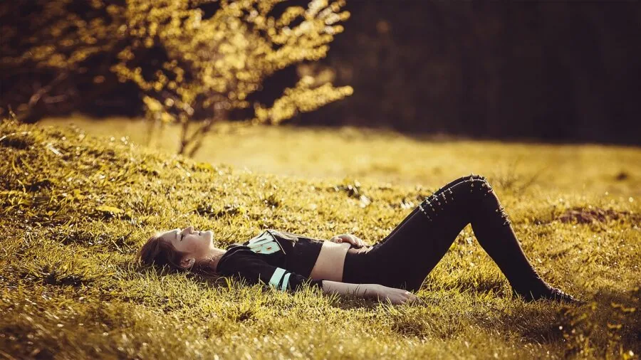 Person enjoying a deeply reclined lounging position outdoors in natural daylight