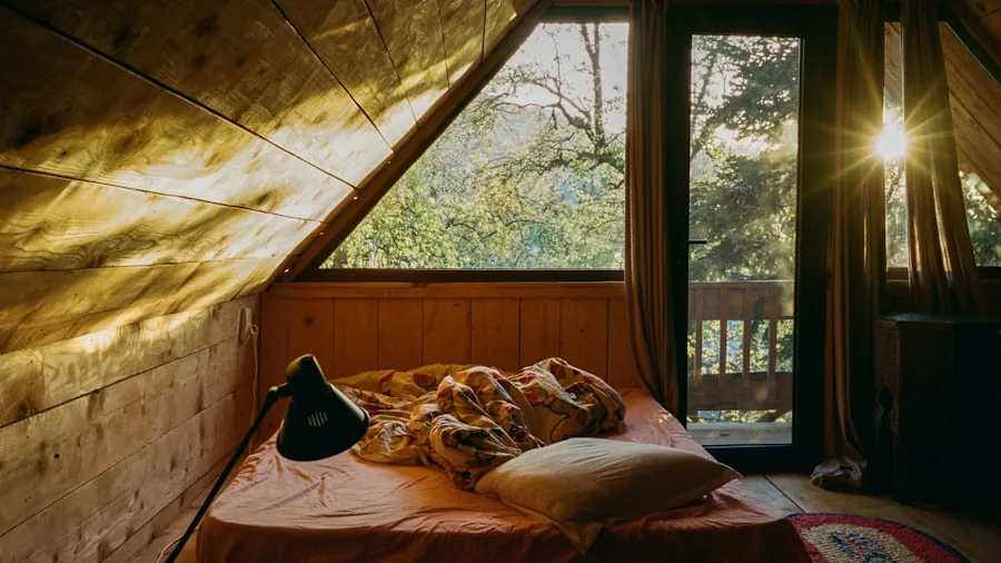 Person enjoying a warm, cozy bed with natural morning light streaming through a window