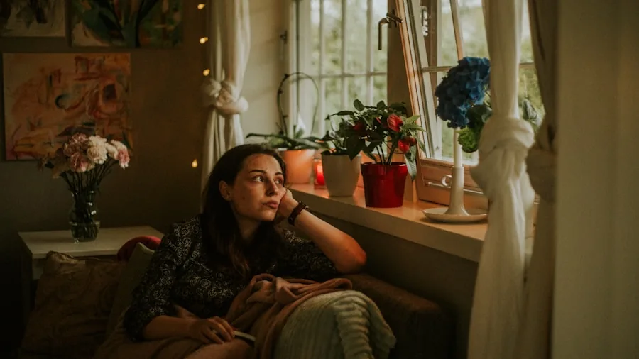 Person enjoying cool air circulation in a bright, comfortable home interior space
