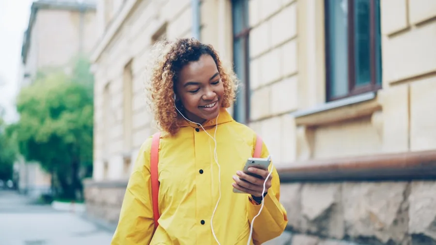 Person enjoying high-quality sound from a portable speaker in a natural outdoor setting