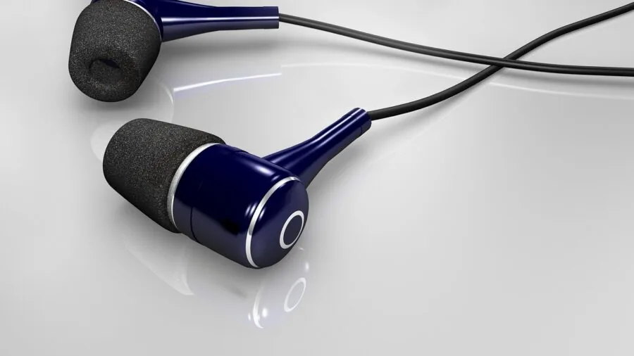 Person enjoying music on portable audio device in everyday setting