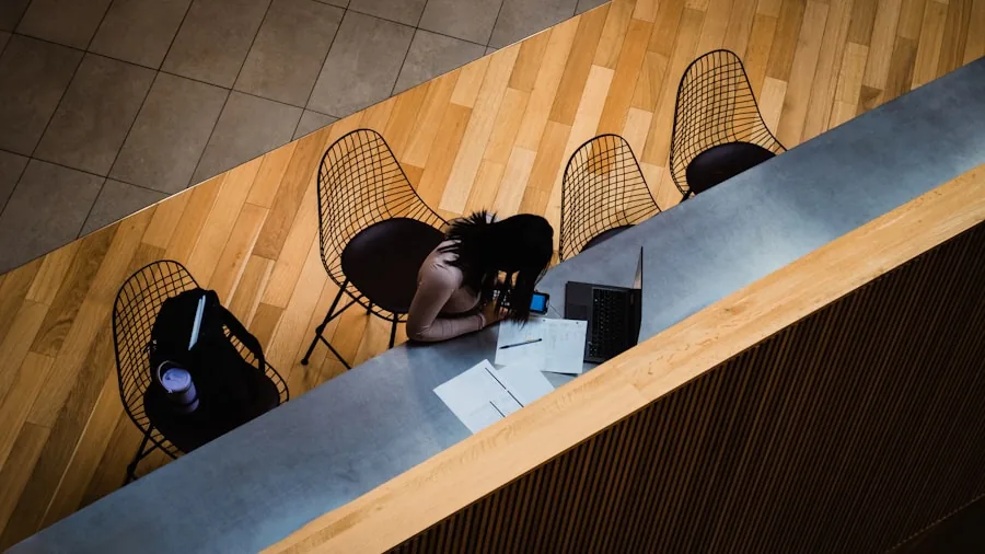 Person enjoying peaceful moment with noise-cancelling headphones in a calm, natural setting