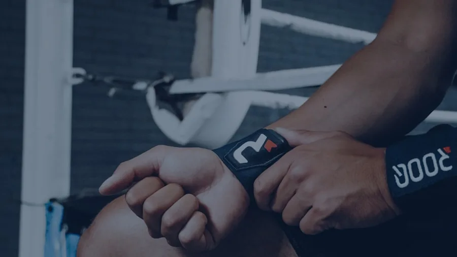 Person examining compression sleeve on arm during fitness routine