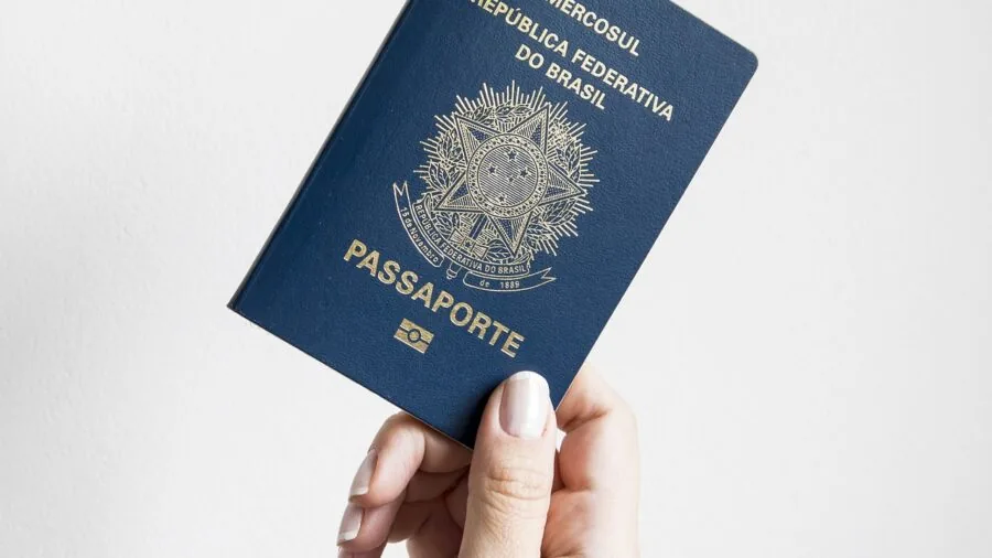 Person examining passport while traveling, representing travel security and RFID protection awareness