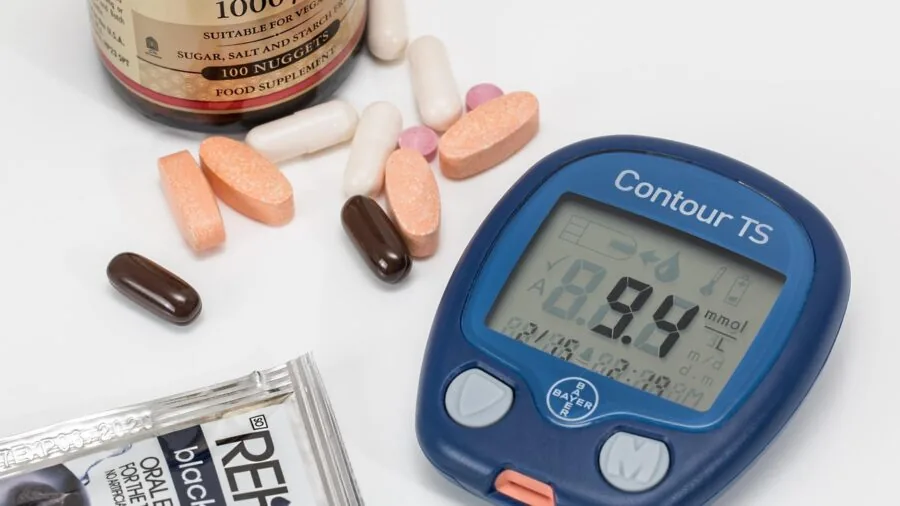 Person examining supplement bottle label to understand ingredients and bioavailability information