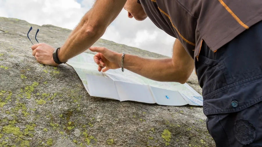 Person examining water resistance specifications on device in natural outdoor setting