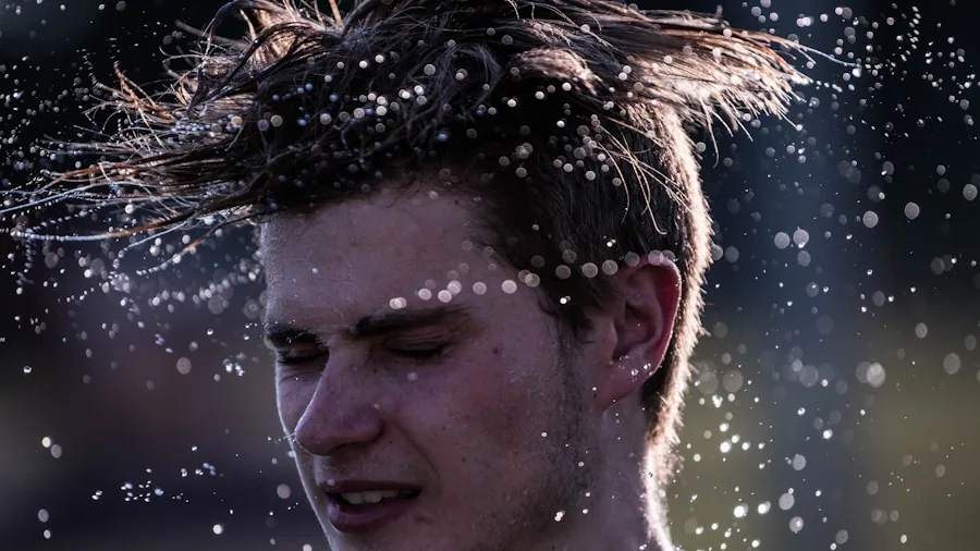 Person exercising outdoors with sweat visible on skin during workout session