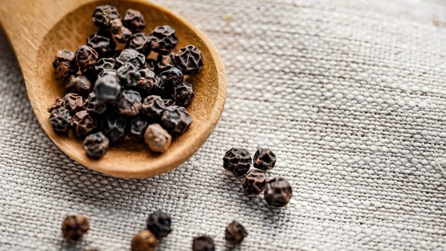 Person exploring natural scents from botanical ingredients and essential oils