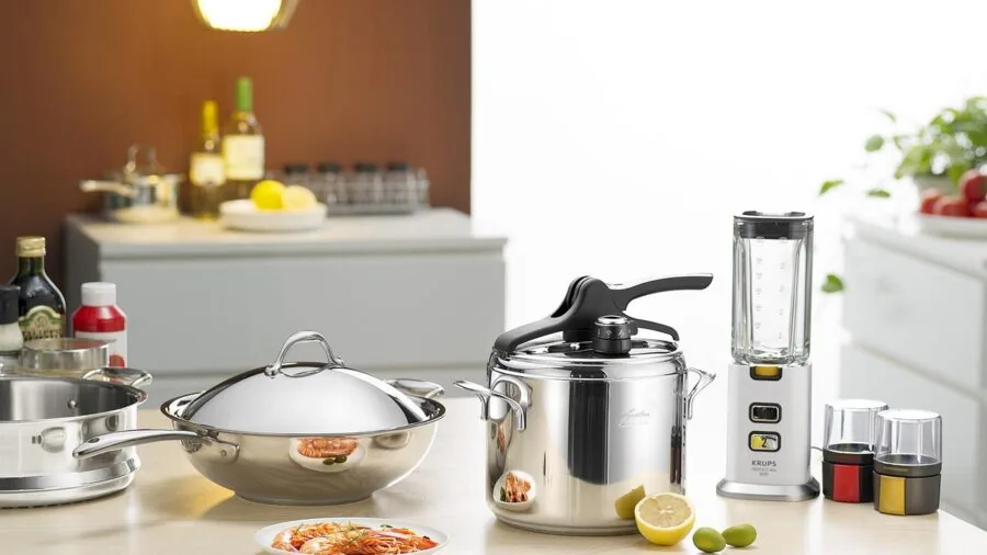 Person grating fresh citrus fruit in a bright kitchen, demonstrating food preparation with quality kitchen tools
