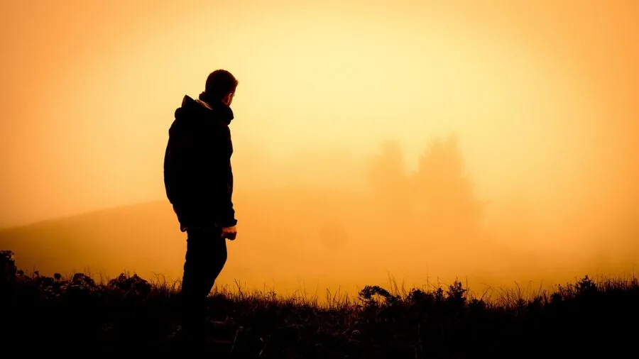 Person hiking through mountainous landscape making quick directional decisions during fast-paced outdoor navigation