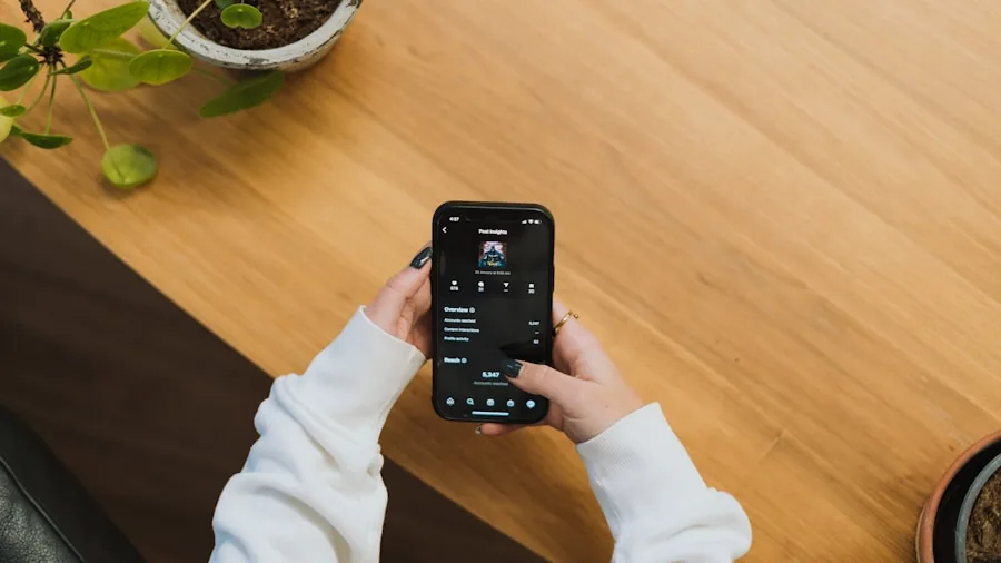 Person in living room interacting with smart home voice assistant device on shelf