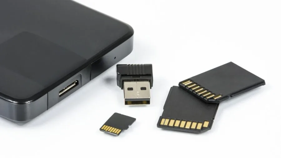 Person inserting microSD card into smartphone or tablet device