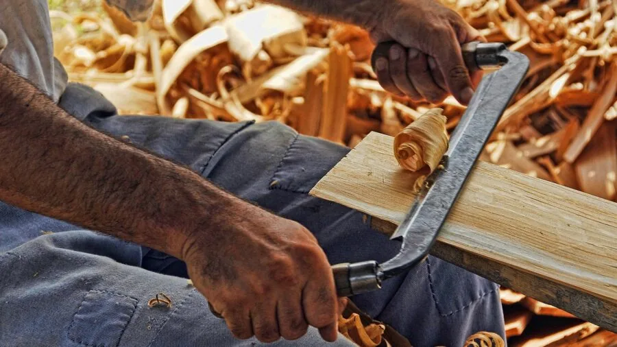 Person inspecting quality tool equipment with confidence, representing brand trust and product reliability in outdoor setting