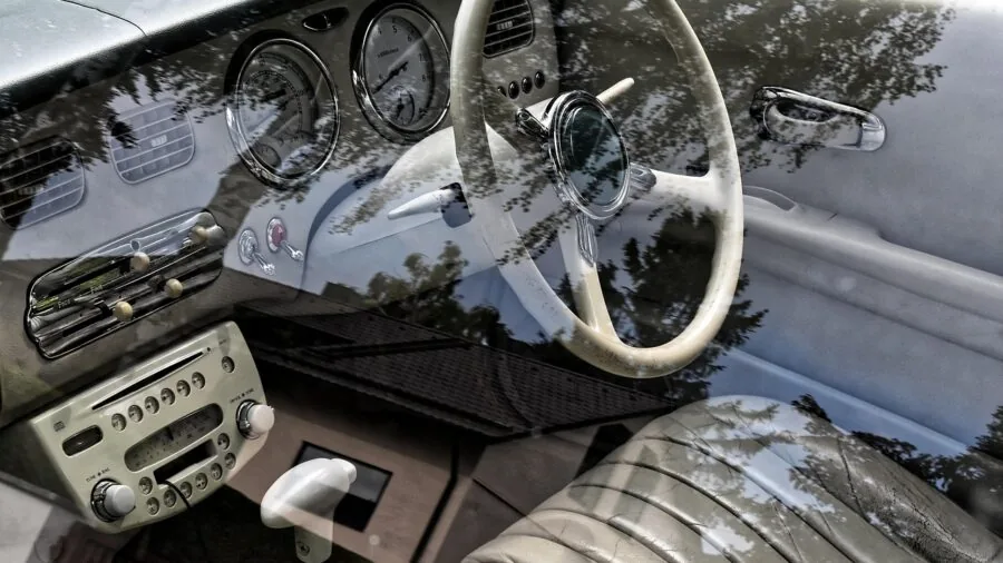 Person installing a console tray into a vehicle interior without tools