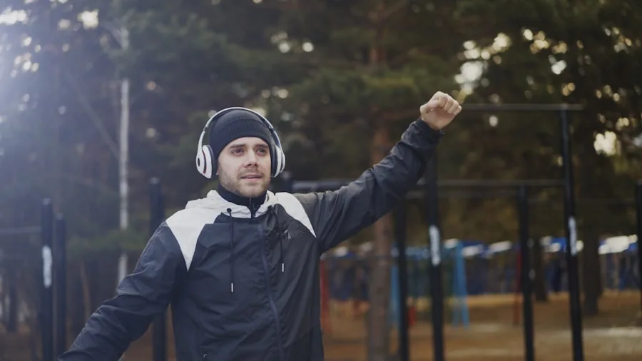 Person jogging outdoors with earbuds, focused and energized during workout session