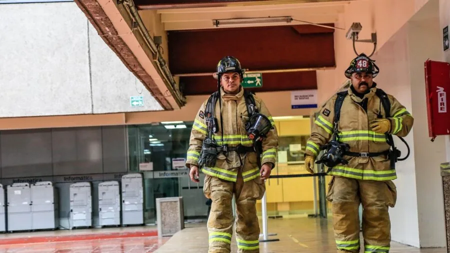Person locating emergency tools in dark conditions during crisis preparedness