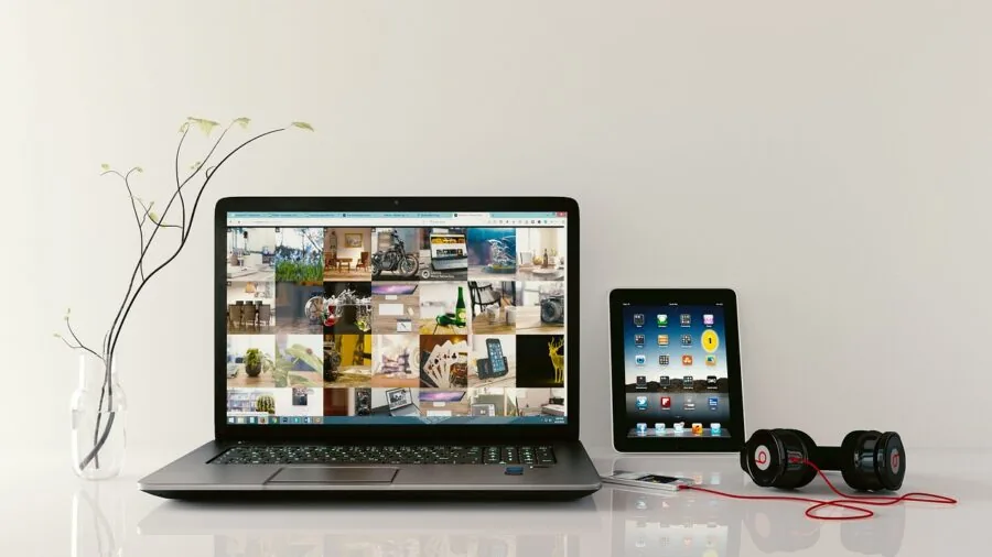 Person monitoring indoor air quality with digital sensor display in modern home living room