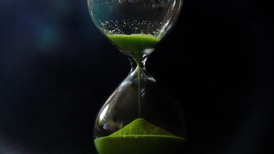 Person monitoring time on digital timer during precision work task in studio setting