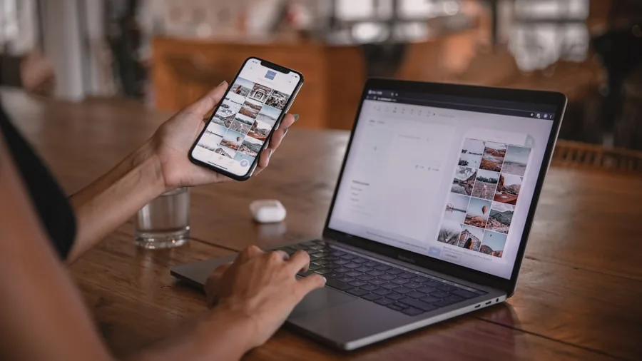 Person multitasking with laptop and smartphone, representing cross-device ecosystem integration