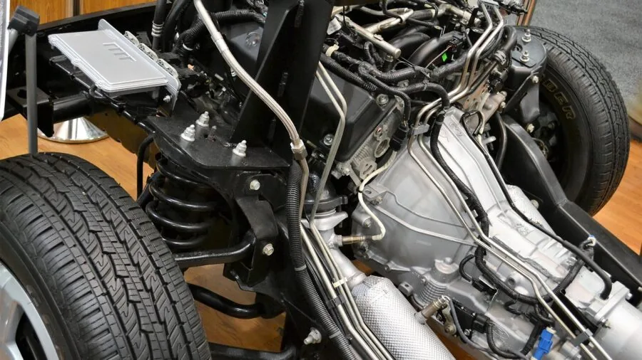 Person organizing automotive supplies and spare parts in home garage workshop