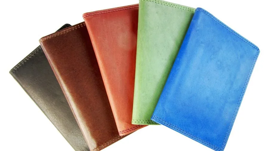 Person organizing multiple cards in wallet, showing card organization and storage capacity