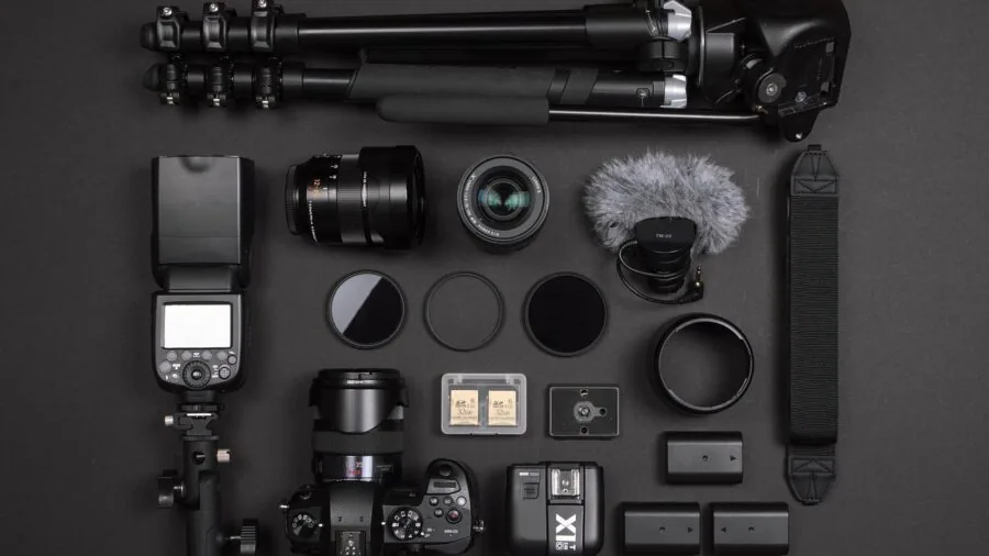 Person packing professional equipment into a portable case for on-location shoots