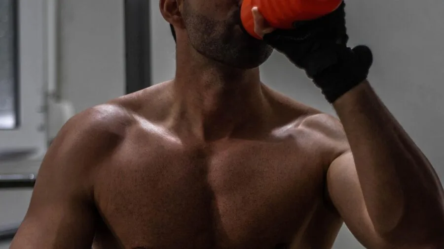 Person performing leg workout on weight bench in home gym with focused form