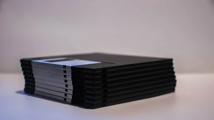 Person quickly transferring digital files on laptop, representing fast data transfer speeds and storage technology