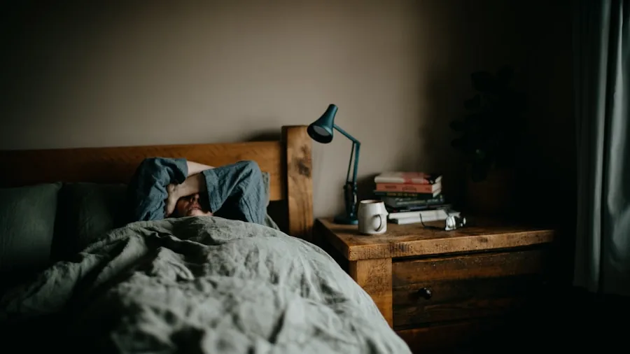 Person reaching for phone on nightstand in morning light, exploring charging convenience in bedroom setting