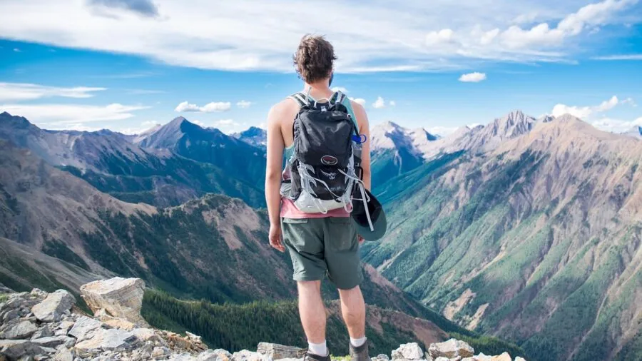 Person recording a video outdoors while exploring nature, capturing real-world perspective