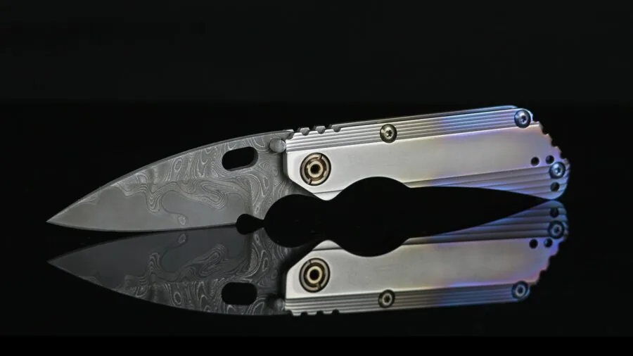 Person replacing utility knife blade during home improvement project