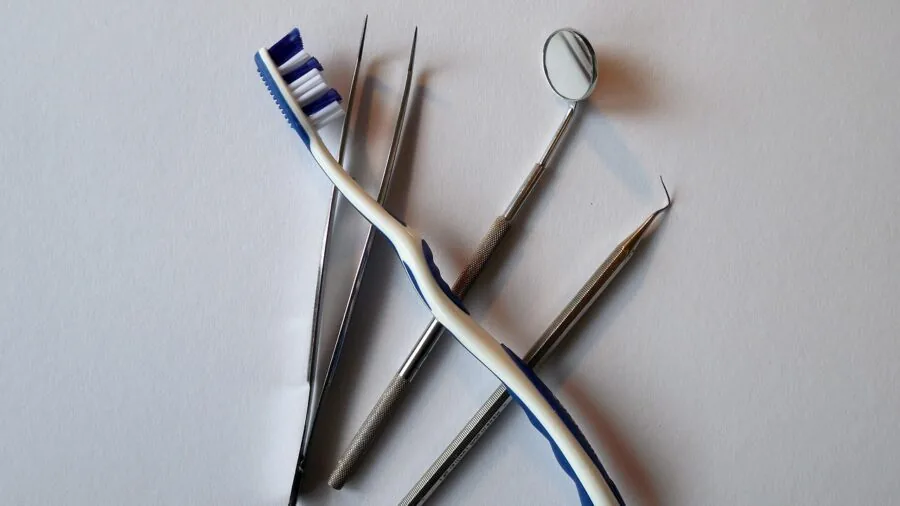 Person reviewing dental whitening ingredients and components in natural lighting