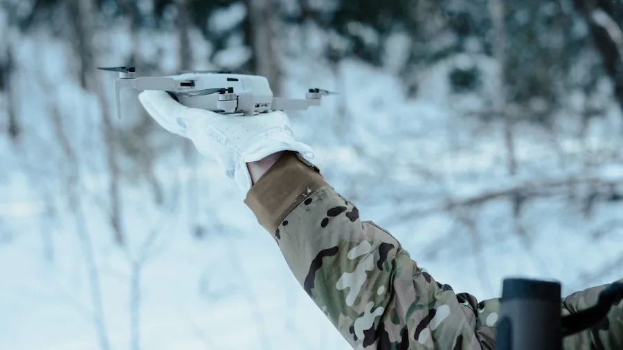 Person reviewing drone equipment and accessories outdoors, comparing options and planning purchases