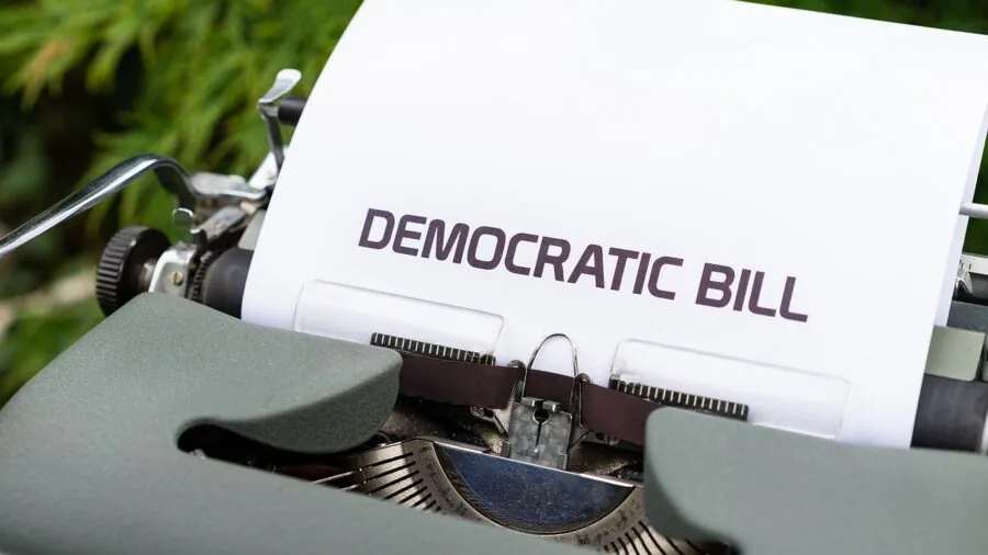 Person reviewing financial documents and bills at home, representing cost analysis and budgeting decisions