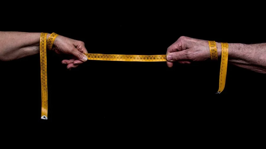 Person reviewing health data on wearable device to verify tracking accuracy