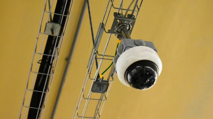 Person reviewing security camera footage on monitor showing clear video quality details